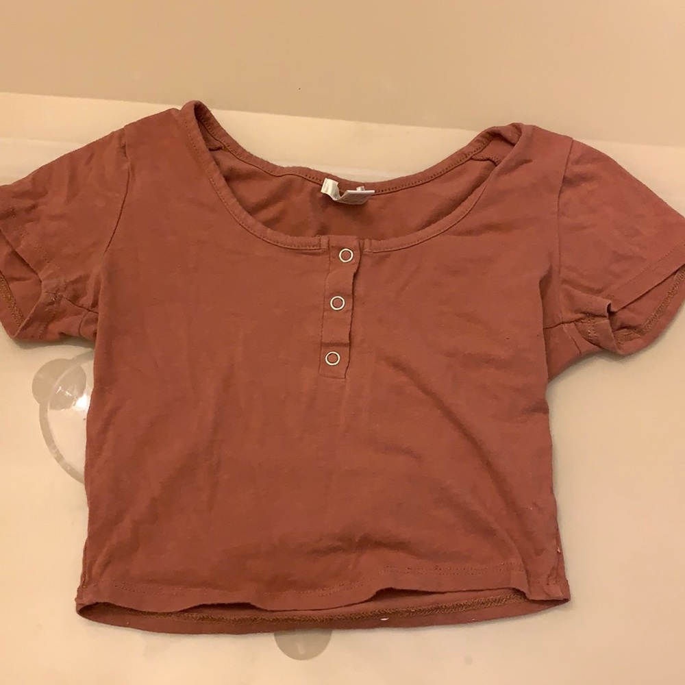 orange brownish shirt